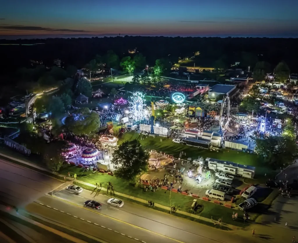 Aerial view of Tiblow Days 2025 carnival with Ferris wheel, rides, and festival crowd in Bonner Springs Kansas